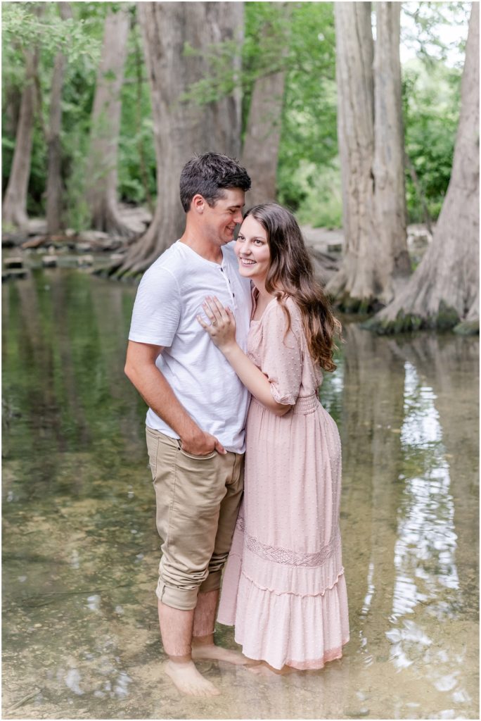 couple standing in creek at cibolo nature center