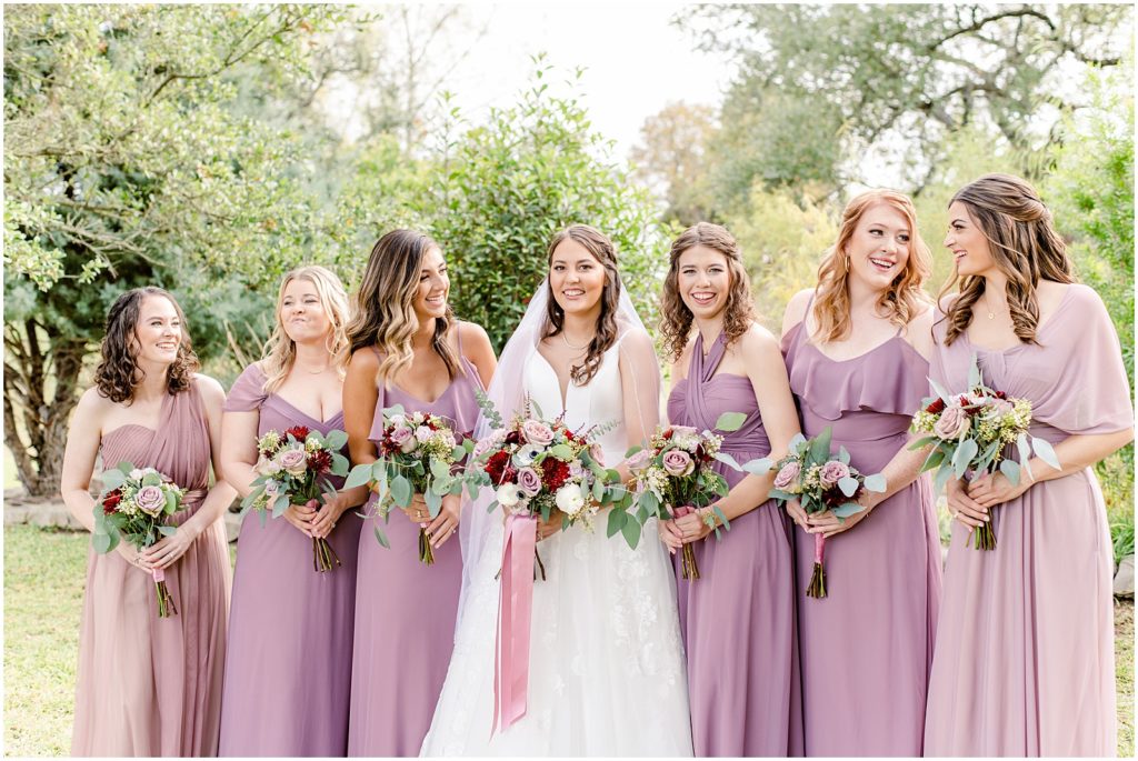 bridesmaids smiling at one another