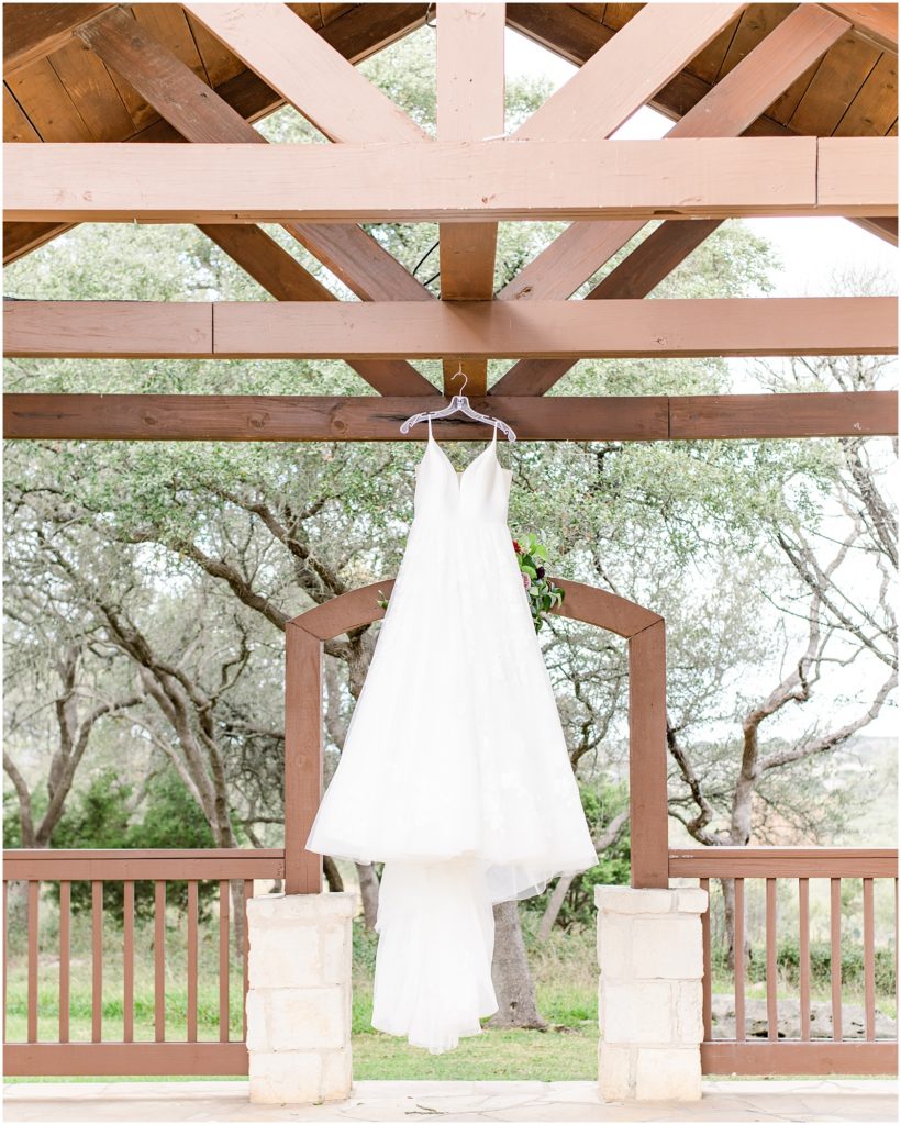wedding dress hanging at ceremony space at the milestone
